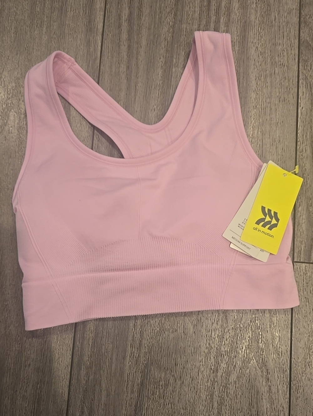 all in motion Light Pink Seamless Racerback Sports Bra With Reovable Pads.